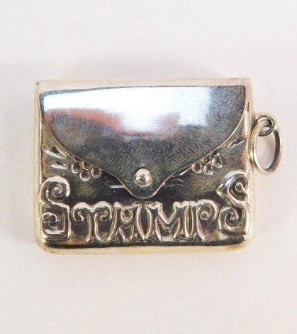 A silver cased stamp case fob pendant, of envelope form, embossed 'Stamps', with floral engraving, chain ring attachment, marked 925, 2.5cm wide.