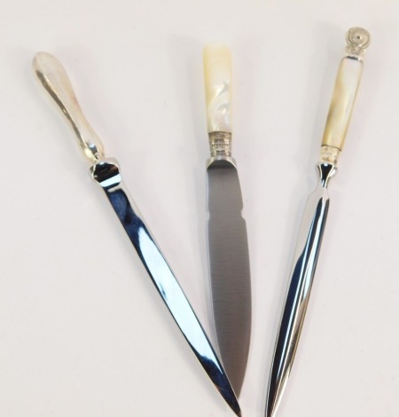 A group of mother of pearl and silver handled letter openers, comprising a silver handled and stainless steel blade letter opener, Sheffield c1920's, a mother of pearl handled and silver plated collar, stainless steel blade letter opener, and another with