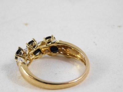 A 9ct gold dress ring, set with imitation diamond and sapphire stones, in crossover claw setting, size P½, 3g all in. - 3