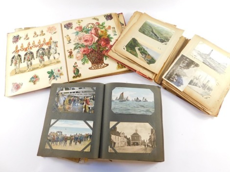 Deltiology. Two Edwardian postcard albums containing topographical, sentimental, and humorous cards, together with a Victorian scrap album of cut outs. (3)