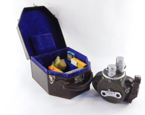 A Bell & Howell 70 - DL cine camera, with Taylor Hobson lenses and gauges, in fitted carrying case.