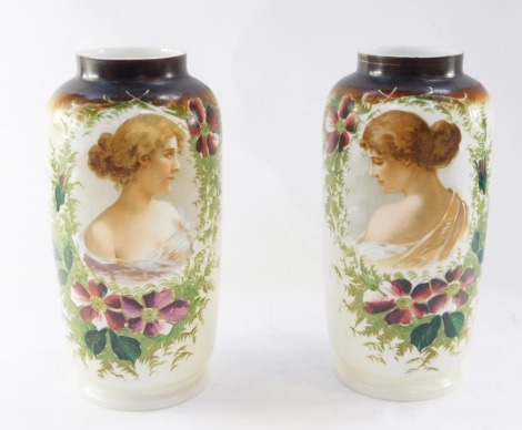 A pair of late 19thC opaline glass vases, each painted with a bust profile of a lady, framed by flowers, beneath a brown rim, 33cm high.