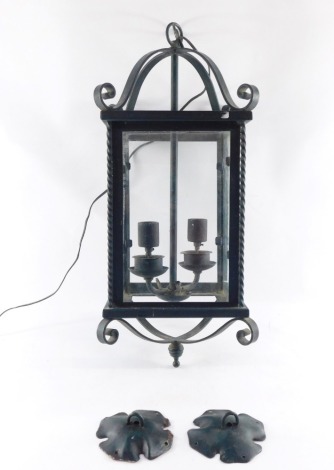A green wrought iron hanging lantern, with floral point detailing, 60cm high.