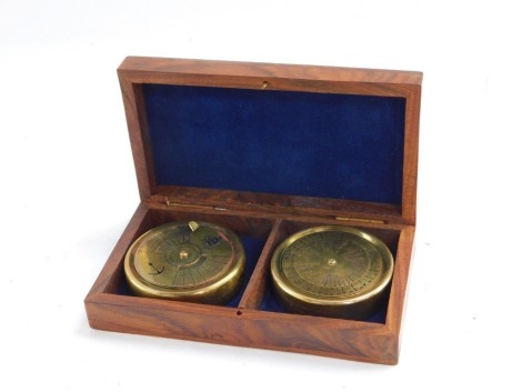 Nautical Interest. A pair of calendar and compass dials, in a fitted wooden case, with brass anchor inlay, 4cm high, 14cm wide, 7.5cm deep.