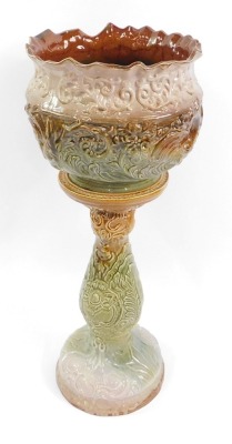 A Wood Rhydding green and brown pottery jardiniere and stand, with floral and leaf moulded decoration, impressed mark, 80cm high, 31cm diameter.