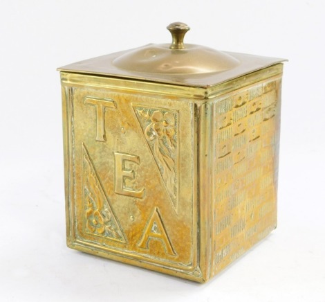 An early 20thC hammered brass tea canister, of square section with floral detailing, lift lid, on bun feet, 14cm high.