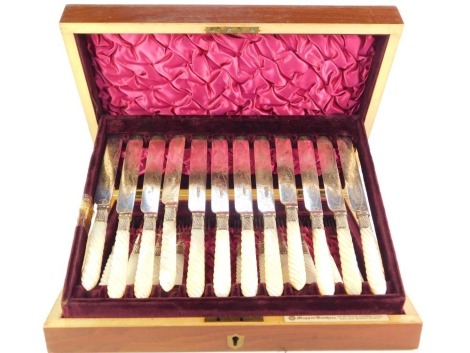 A Victorian silver plate and mother of pearl fruit canteen of cutlery, with twelve place settings, in a fitted mahogany and satinwood cross banded case, Mappin Brothers, London, 6cm high, 33cm wide, 26cm deep.