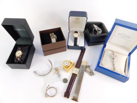 A group of wristwatches, to include a lady's Rotary Elite, desk clock, Safari Gem, Santos, Royal and Temptation Florals bangle, some boxed. (1 tray)