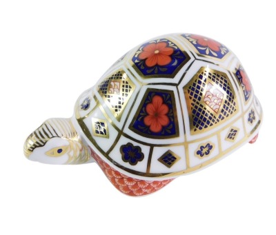 A Royal Crown Derby Imari tortoise paperweight, lacking stopper, No XLIX, 12cm wide, boxed.