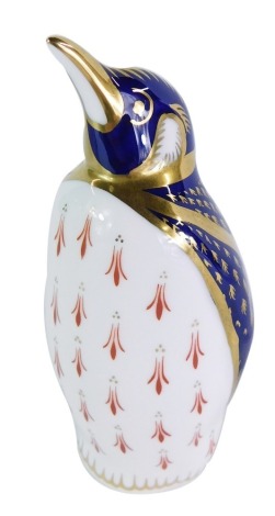 A Royal Crown Derby Emperor Penguin paperweight, No XLVIII, lacking stopper, 14cm high, boxed.