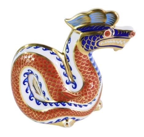 A Royal Crown Derby dragon paperweight, gold stopper, 11.5cm high, boxed.