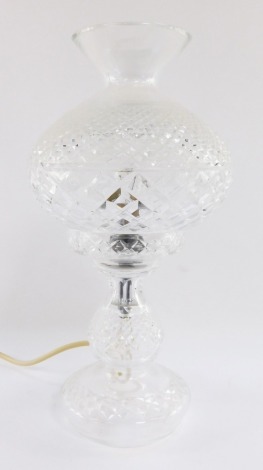 A Waterford Crystal style electric table lamp, with a mushroom shaped shade, on a baluster base, 34cm high.