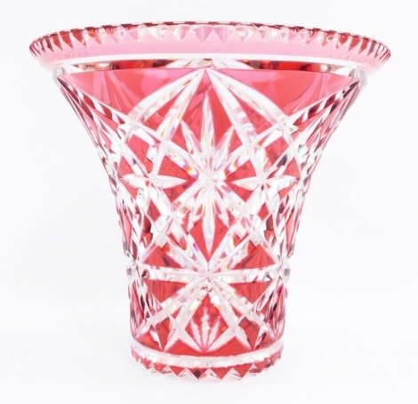 A cut flashed cranberry glass vase, of flared form, 20cm high, 22cm wide.