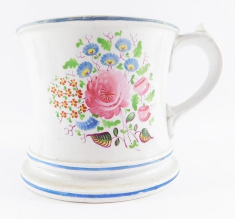 An Elsmore & Forster pottery frog tankard, with internal moulded frog, painted externally with flowers, 11cm high. (AF)