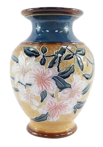 A Royal Doulton late 19thC stoneware vase, Art Union of London, with a blue glazed interior, decorated externally with white and pink blossom, impressed marks, 19cm high. (AF)