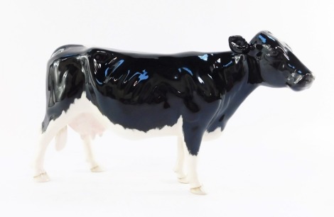 A Beswick Shetland cow, model 4112, 13cm high.