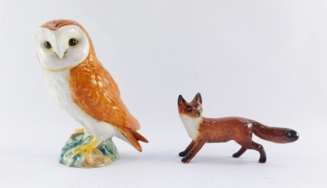 Two Beswick animal ornaments, comprising a fox, 6cm high, and barn owl, 11cm high.