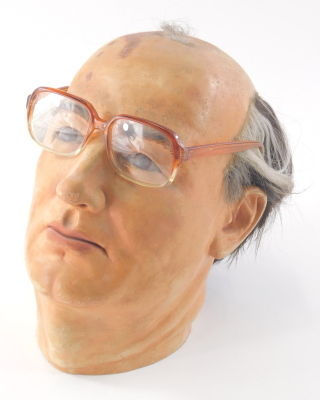 A late 20thC model head of Mikhail Gorbachev, in plaster and papier mache, with removable glasses, originally from a prop hire company London, 26cm high. - 2