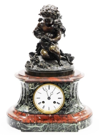 A 19thC French marble and bronze mantel clock, the top with a bronze figure of a cherub holding roses, on a red and black marble shaped base, with a white painted dial with Roman numerals and eight day movement, 41cm high, 30cm wide, with two winding keys