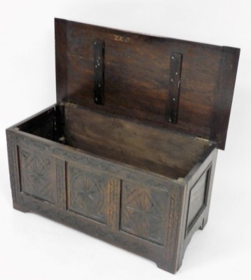 A 17thC style oak coffer, with a foliate carved hinged lid, vacant interior, the triple panelled front carved with floral medallions, raised on bracket feet, 45cm high, 91cm wide, 46cm deep (AF) - 3