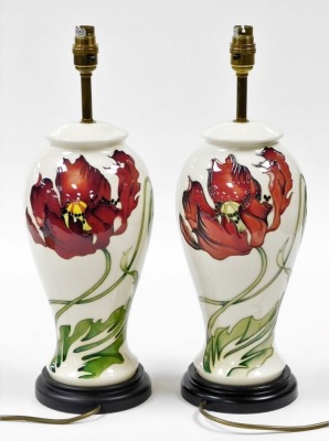 A pair of Moorcroft pottery Dancing Flame table lamps, of baluster form, against a cream ground, on turned hardwood bases, 47cm high overall. - 2