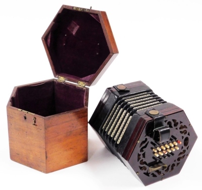 A late 19thC mahogany and canvas concertina or squeeze box, with twenty four painted bone keys, 15cm x 12cm, in a mahogany fitted box.