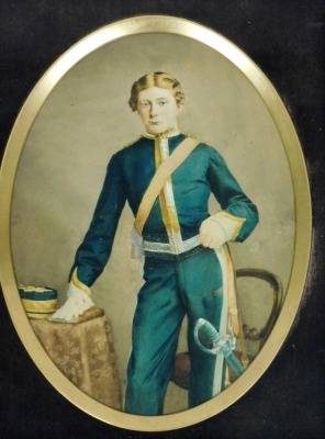 19thC School. Portrait of a young soldier, hand tinted photograph, 19cm x 14cm, in an oak frame.