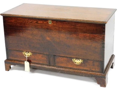 An 18thC oak mule chest, the hinged lid enclosing a vacant interior above two drawers, on bracket feet, 69cm high, 104cm wide, 52cm deep.