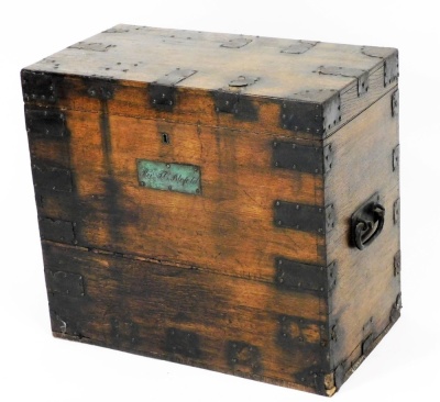 A 19thC oak and metal bound silver chest, bearing a plaque for Rev J.C. Blofeld, the hinged lid enclosing a vacant interior, 54cm high, 59cm wide, 33cm deep.