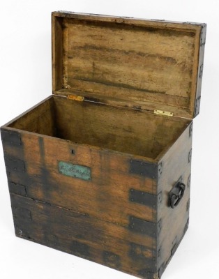 A 19thC oak and metal bound silver chest, bearing a plaque for Rev J.C. Blofeld, the hinged lid enclosing a vacant interior, 54cm high, 59cm wide, 33cm deep. - 2