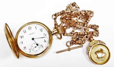 A Waltham gold plated gentleman's full hunter pocket watch, keyless wind, enamel dial bearing Arabic numerals, subsidiary seconds dial, on a 9ct rose gold fancy link Albert chain with two lobster claw clasps, and a 9ct two colour gold shield medallion fob