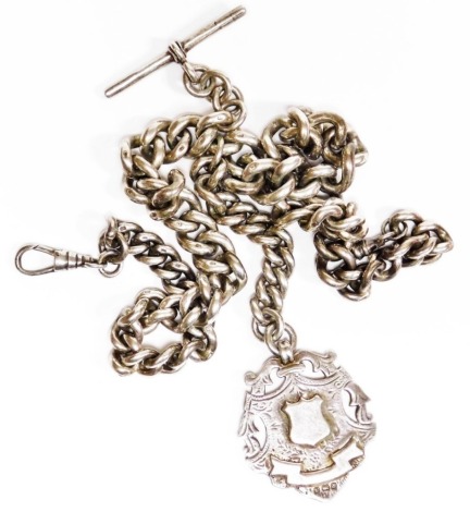 A heavy curb link silver watch chain, with two clip clasps and T bar, together with a shield fob, the main chain 40cm long, with pendant drop and shield 150.5g all in.