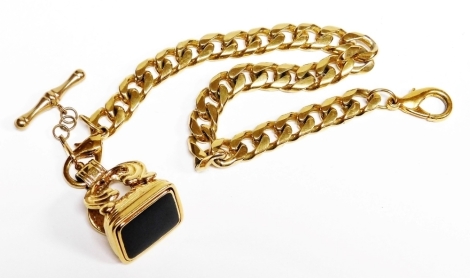 A gold plated seal and watch chain, the curb link chain with T bar and additional clip, set with black agate, the chain 30cm long.