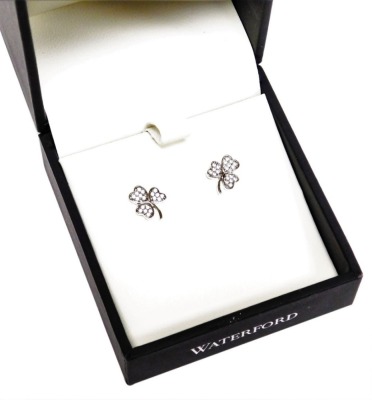 A pair of silver and stone set three leaf clover earrings, each with butterfly backs, in a fitted case.