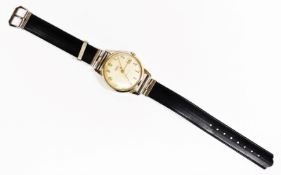 A Smith's gentleman's wristwatch, in gold plated outer surround, on stainless steel back, marked five jewel shock proof, with date aperture, the dial 3cm wide, on a black leather strap. - 2