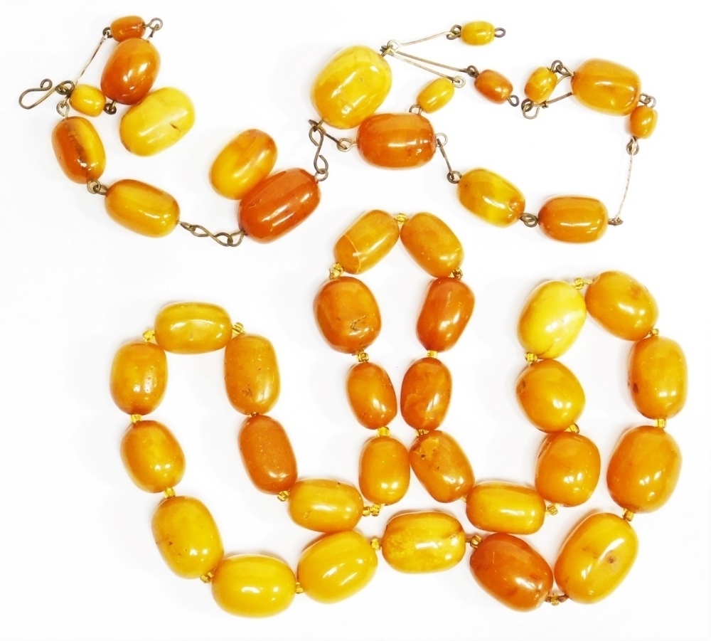Early 20th century Butterscotch amber bead necklace, forty-two oval and  round graduated beads, the l