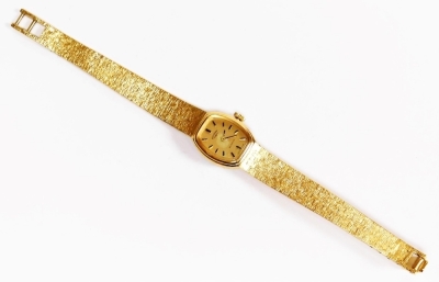 A Rotary gold plated lady's wristwatch, with oval shaped dial, on Brocade and bark effect type bracelet, 18cm long, boxed. - 2