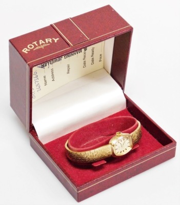 A Rotary gold plated lady's wristwatch, with oval shaped dial, on Brocade and bark effect type bracelet, 18cm long, boxed. - 3