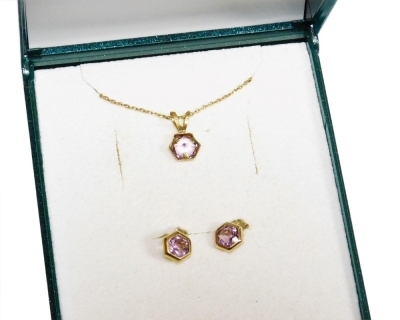 A 9ct gold amethyst set necklace and earring set, the hexagonal amethyst pendant with matching earrings, on a fine 9ct gold chain, 44cm long, 1.4g all in, boxed.