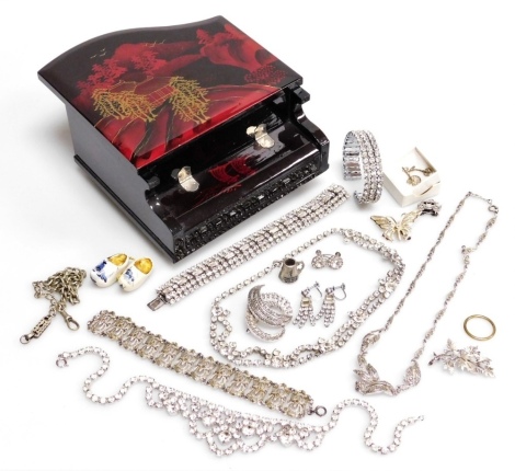 A group of costume jewellery, to include diamante set necklaces, dress jewellery, etc., in a Japanese piano jewellery box.