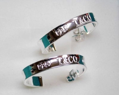 A pair of Tiffany style hoop earrings, dated 1997, white metal stamped 925, with butterfly backs, 7.1g, with box and bag. - 2