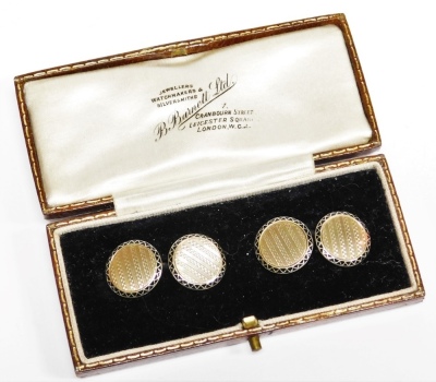 A pair of 9ct gold cufflinks, each circular with engine turned detailing and outer black enamel design, with curb links, 5.9g all in, in fitted case.