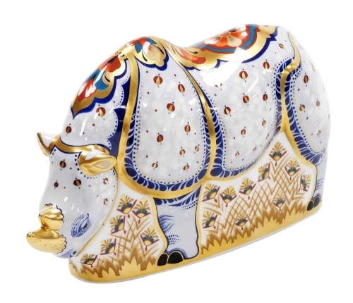 A Royal Crown Derby White Rhino porcelain paperweight, specially commissioned by Sinclairs, limited edition number of 1000, with gold stopper and red printed mark to underside, 21cm wide, boxed, with certificate.