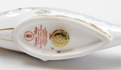 A Royal Crown Derby Guild Exclusive Oceanic Whale porcelain paperweight, with gold stopper and red printed mark to underside, 22cm wide, boxed. - 3