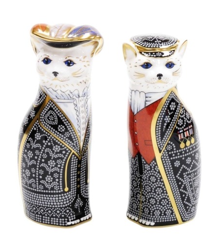 A pair of Royal Crown Derby Pearly King and Queen porcelain paperweights, to celebrate the Diamond Jubilee of HM Queen Elizabeth II 1952-2012, limited edition number 275/350, with gold stopper and red printed mark to underside, 20cm and 19cm high, boxed.