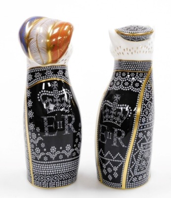A pair of Royal Crown Derby Pearly King and Queen porcelain paperweights, to celebrate the Diamond Jubilee of HM Queen Elizabeth II 1952-2012, limited edition number 275/350, with gold stopper and red printed mark to underside, 20cm and 19cm high, boxed. - 2