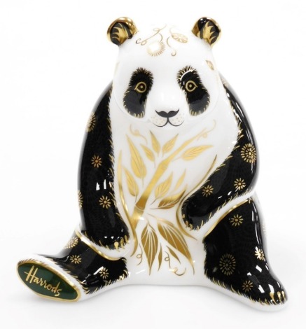 A Royal Crown Derby Harrods Giant Panda porcelain paperweight, limited edition number 108/250, with gold stopper, signed to underside Jane Jones with red printed marks to underside, 12cm high, boxed, with certificate.