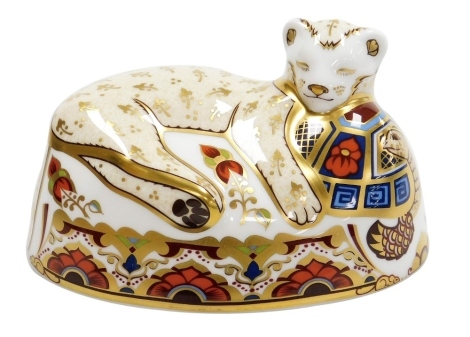 A Royal Crown Derby Lion Cub porcelain paperweight, second in a series of paperweights specially commissioned by Sinclairs, limited edition number 4843/1500, with gold stopper and red printed marks to underside, 14.5cm wide, boxed, with certificate.