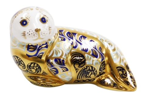 A Royal Crown Derby Harbour Seal porcelain paperweight, limited edition number 4230/4500, with gold stopper and red printed marks to underside, 15cm wide, boxed with certificate.