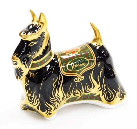 A Royal Crown Derby Harrods Scottish Terrier porcelain paperweight, specially commissioned by Harrods, limited edition number 431/500, with gold stopper, signed Jane James with red printed marks to underside, 14cm wide, boxed with certificate.